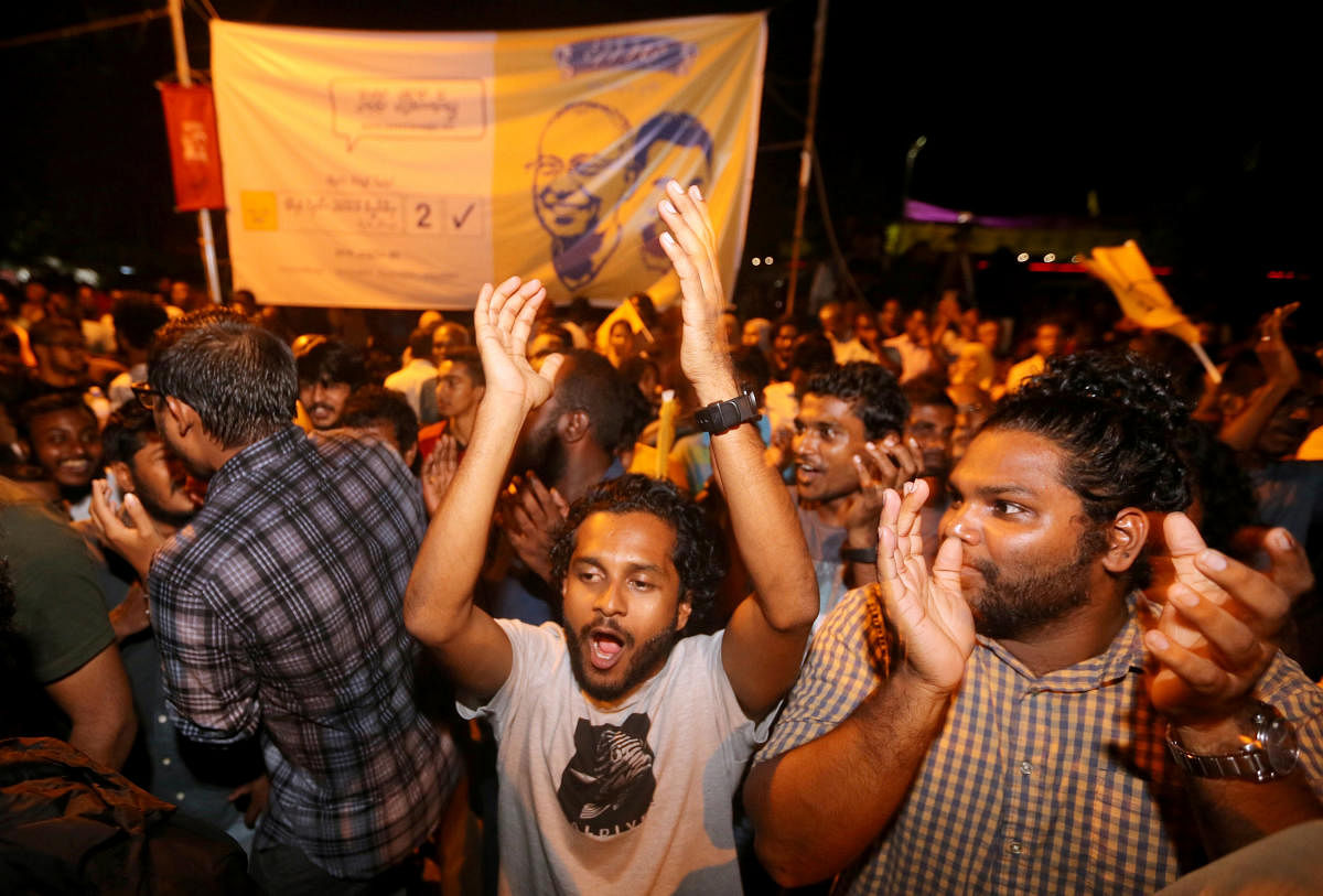 Supporters of Maldivian joint-opposition presidential candidate Ibrahim Mohamed Solih celebrate on the street at the end of the presidential election day in Male, Maldives September 24, 2018. REUTERS/Ashwa Faheem.