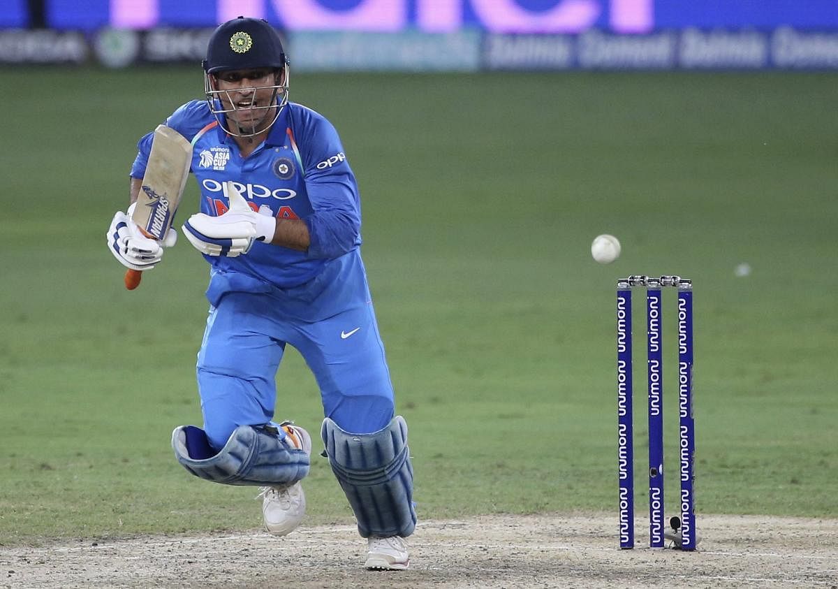 TRYING TIMES M S Dhoni, who hasn't spent much time in the middle, may get an early hit against Afghanistan. AFP