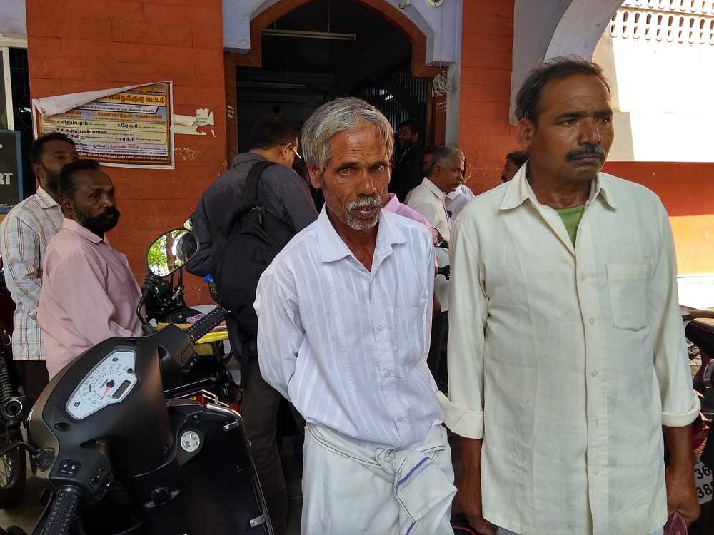 Nagarajan (right) and Pasuvanna (left) outside the court in Gobichettipalayam on Tuesday. (DH photo/ ETB Sivapriyan)