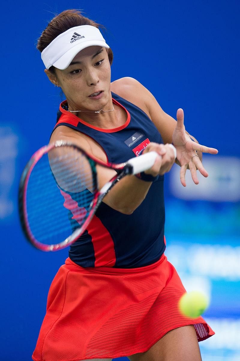 Wang Qiang of China returns against Monica Puig of Puerto Rico during their quarterfinal at the WTA Wuhan Open on Thursday. AFP