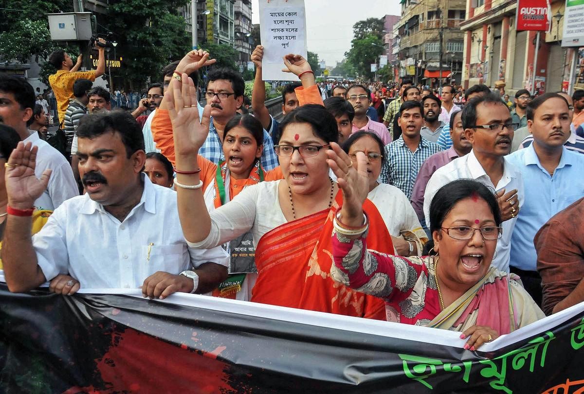 BJP wokers take out a rally against recent killings of BJP's Trilochan Mahato and Dulal Kumar in Purulia, allegedly by the Trinamool Congress party workers, in Kolkata. (PTI file photo)