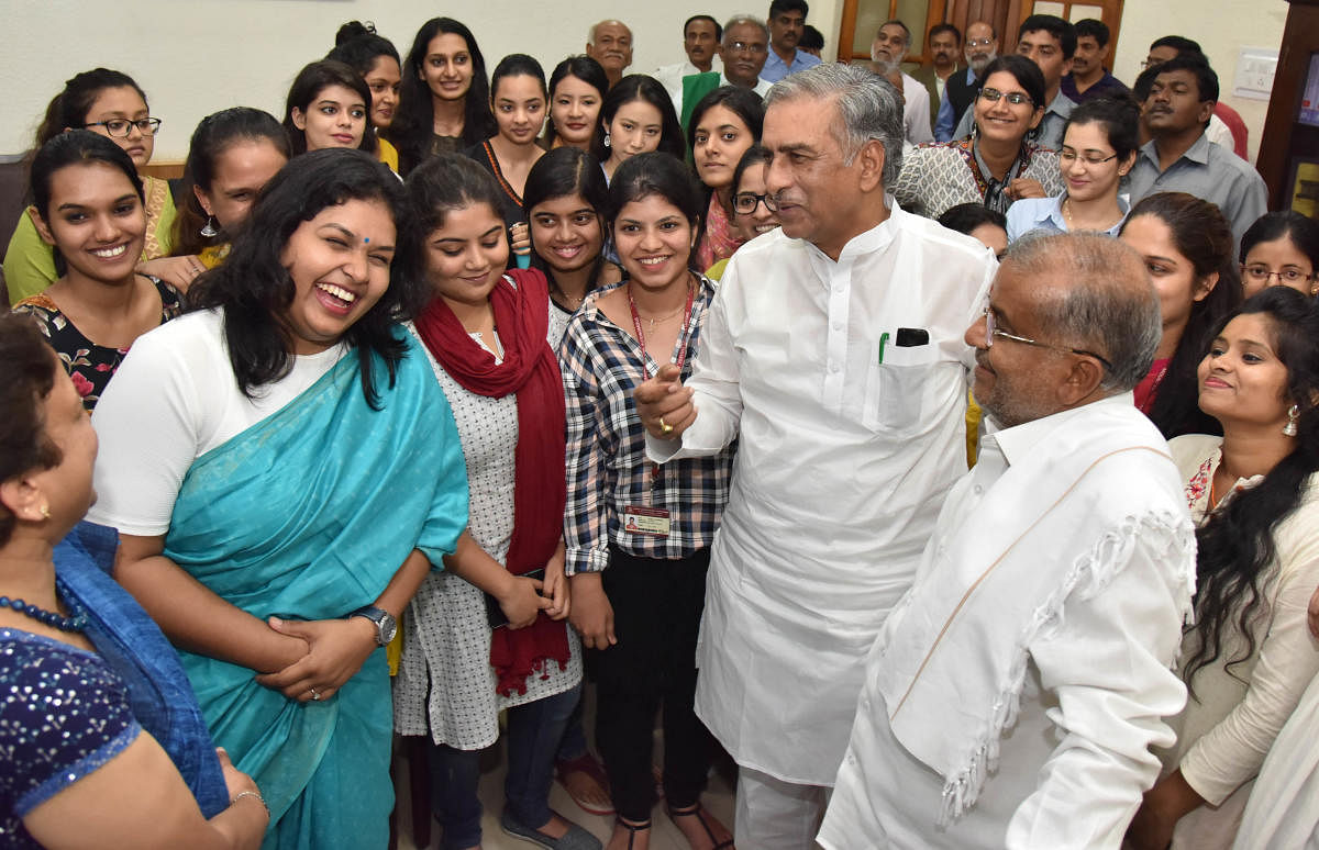 Higher Education Minister G T Devegowda (extreme right) and pro tem Chairman of the Legislative Council Basavaraj Horatti interact with the students of Mount Carmel College, at the Vidhana Soudha in Bengaluru on Wednesday. DH Photo