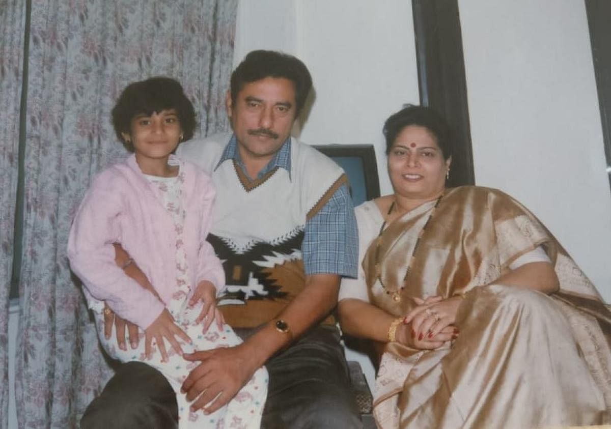 Sudhir Kumar Sharma with wife Kiran and Monisha, the youngest of their three daughters.