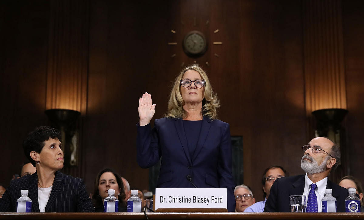 Professor Christine Blasey Ford, the woman accusing Supreme Court nominee Brett Kavanaugh of sexually assaulting her at a party 36 years ago, is sworn in before the US Senate Judiciary Committee on Capitol Hill in Washington, DC, September 27, 2018. AFP