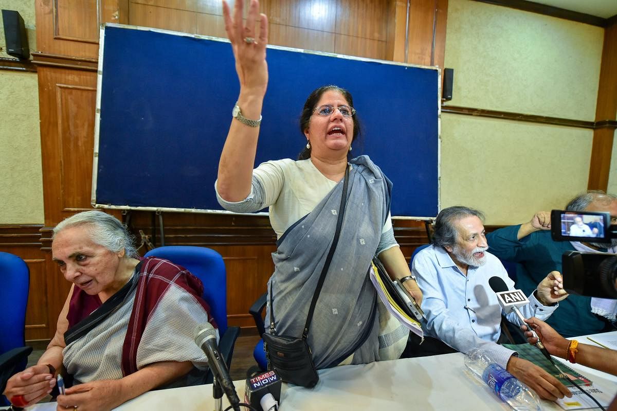 Activists address the media during a press conference on Supreme Court's verdict in relation with Koregaon-Bhima violence arrests, in New Delhi, on Friday. PTI