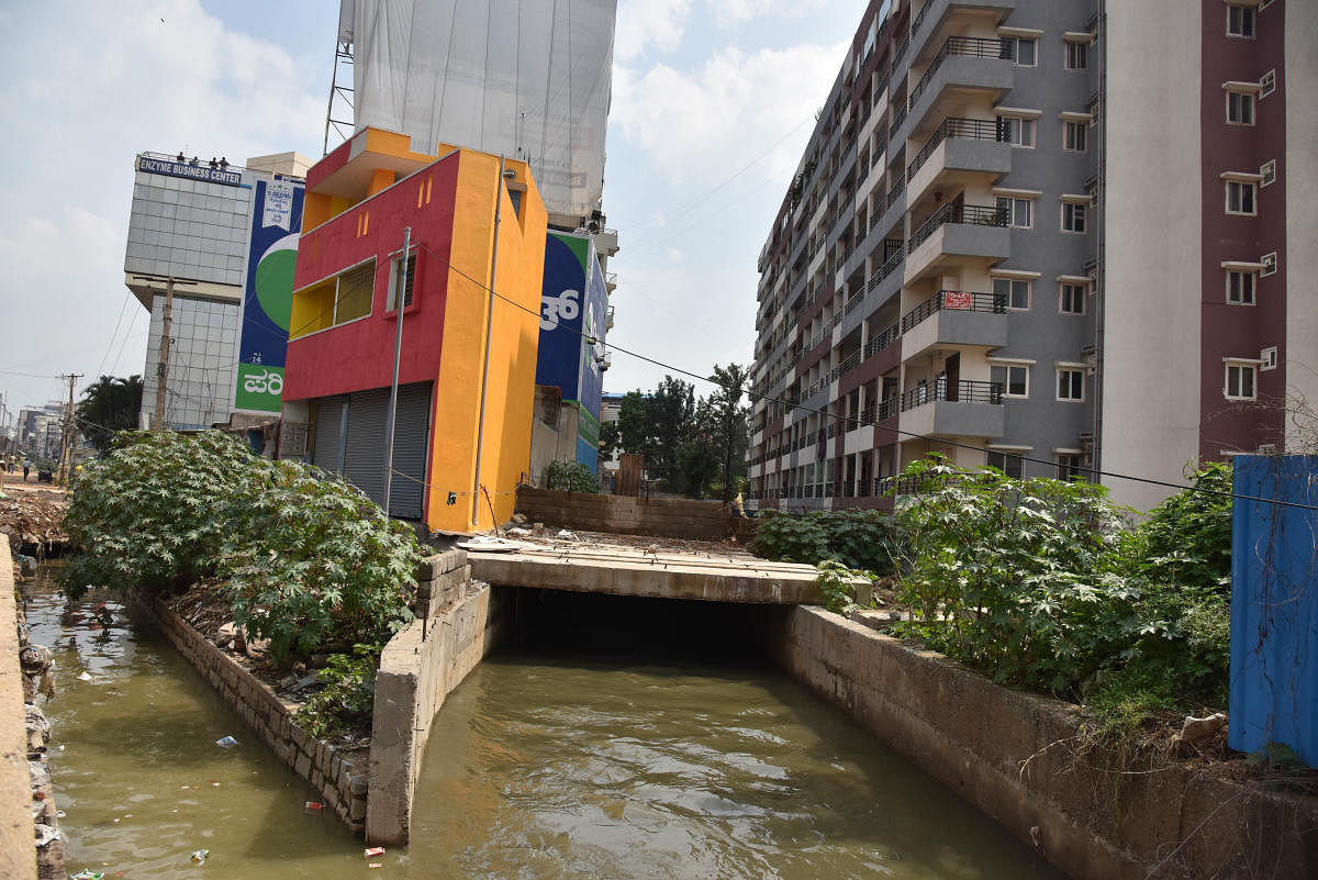 Apartments that have encroached upon a storm water drain on Hosur Road in Bengaluru. DH Photo/BH Shivakumar