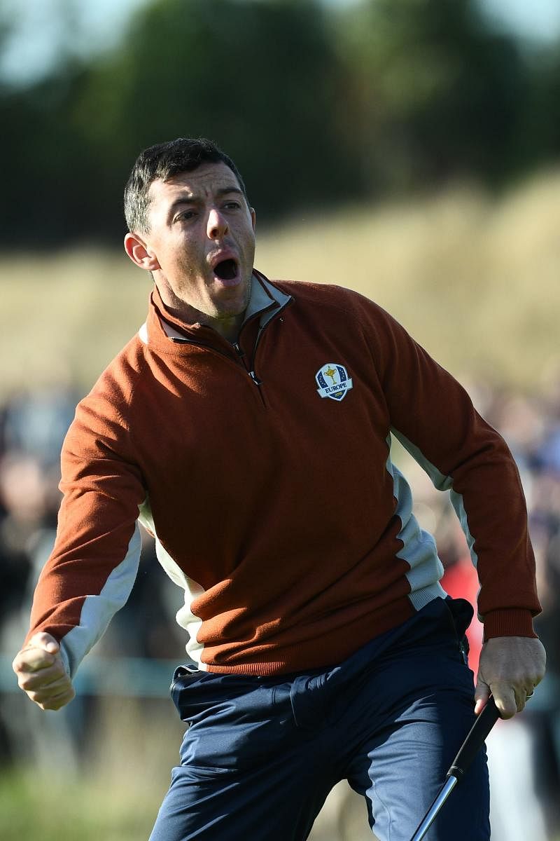 SOLID SHOW: Europe’s Rory McIlroy celebrates after holing a putt during his fourball match on Saturday. AFP