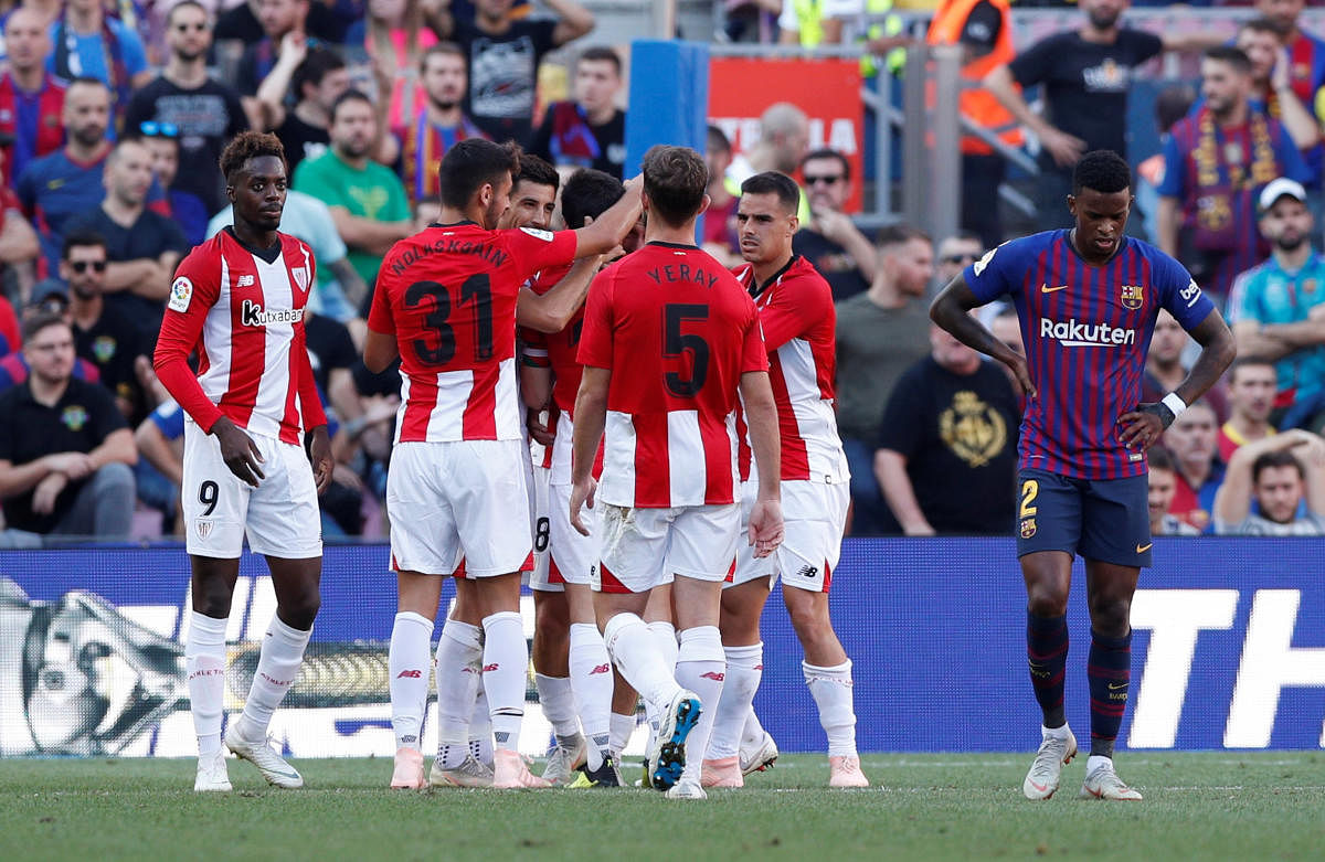 DELIGHTED Athletic Bilbao’s players celebrate after Oscar de Marcos scored their first goal against Barcelona. REUTERS