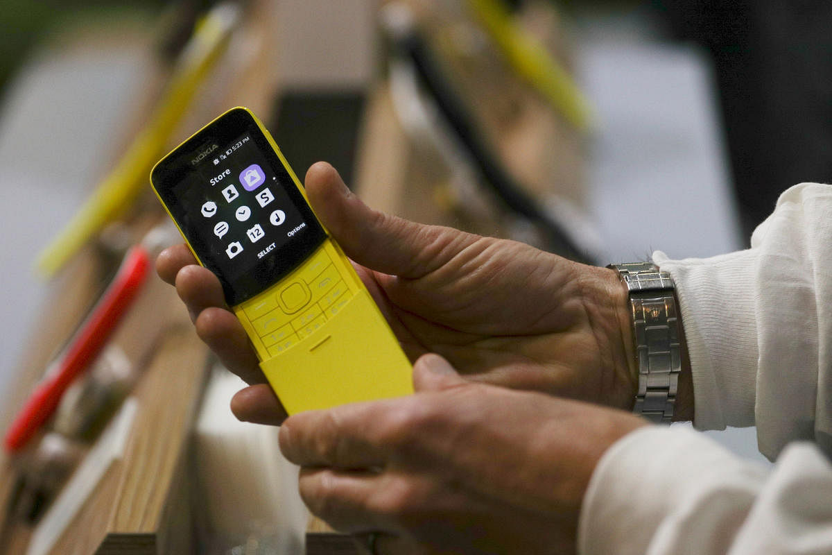 A man holds a Nokia 8110 4G device at the Mobile World Congress in Barcelona recently. REUTERS