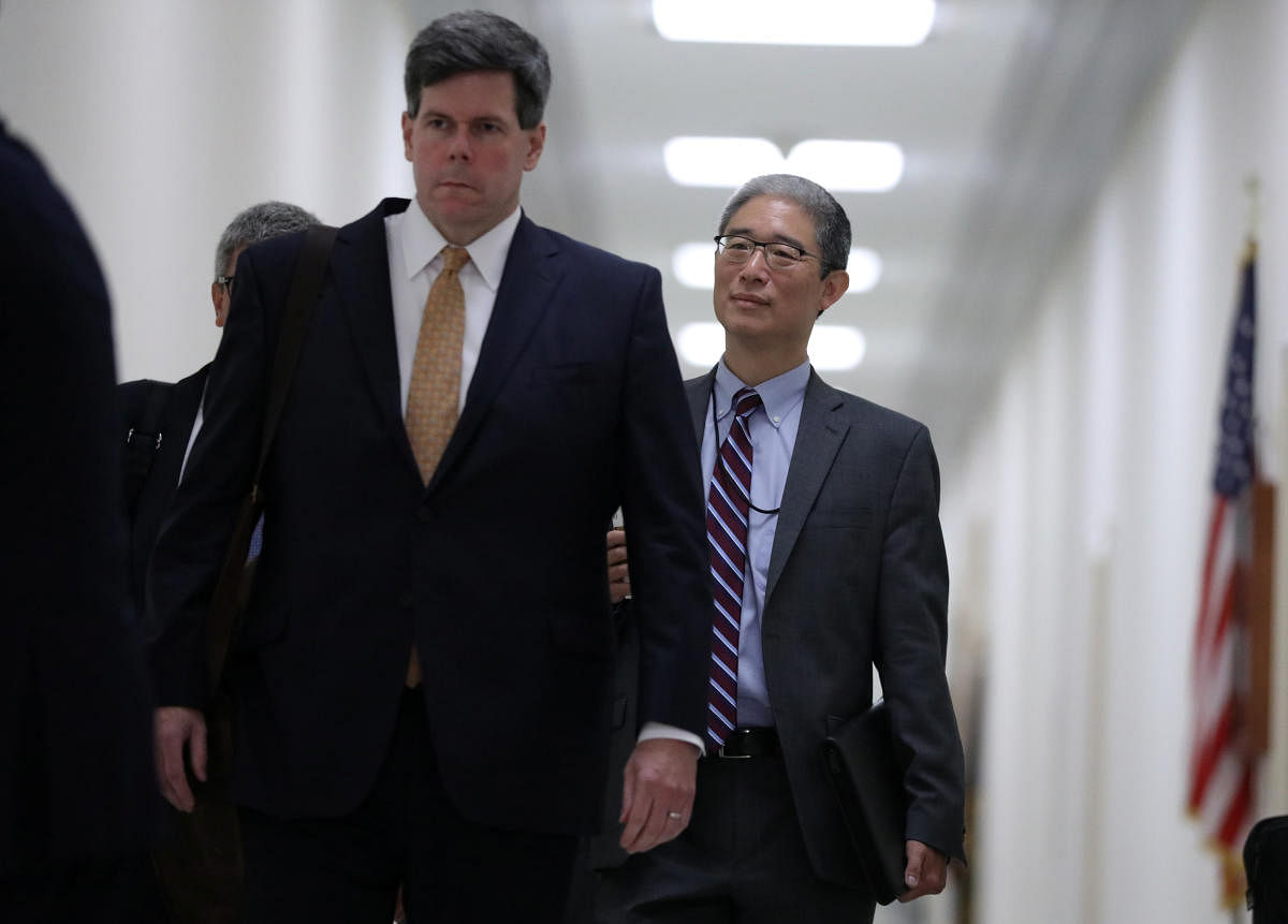 Former associate deputy US attorney general Bruce Ohr (right) arrives to testify behind closed doors before the House Judiciary and House Oversight and Government Reform Committees on his alleged contacts with Fusion GPS founder Glenn Simpson and former British spy Christopher Steele, who compiled a 'dossier' of allegations linking Donald Trump to Russia, on Capitol Hill in Washington on August 28, 2018. Reuters