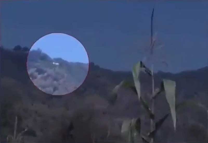 In a video, apparently shot by a witness, the copter is seen flying high near the side of a hill in Poonch. The sound of constant gunfire can be heard, indicating the Indian Army tried to shoot it down. (Screengrab)