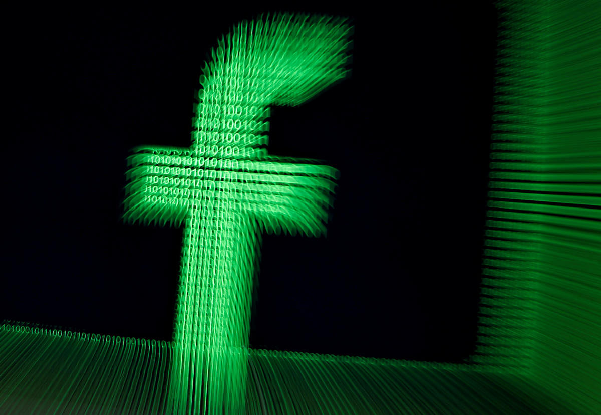 A 3D-printed Facebook logo is seen in front of displayed binary digits in this illustration taken March 18, 2018. (REUTERS Illustration/File Photo)