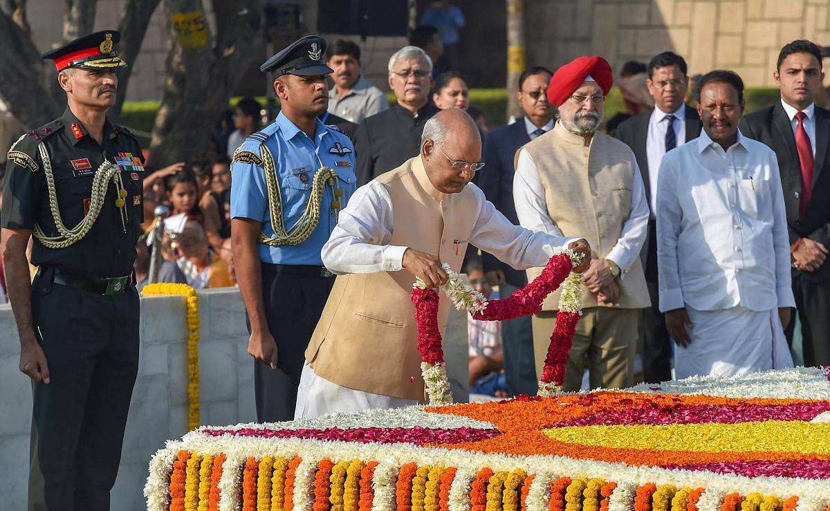 President Ram Nath Kovind pays homage to Mahatma Gandhi on his birth anniversary at Rajghat, in New Delhi, Tuesday, Oct 02, 2018. (PTI Photo)