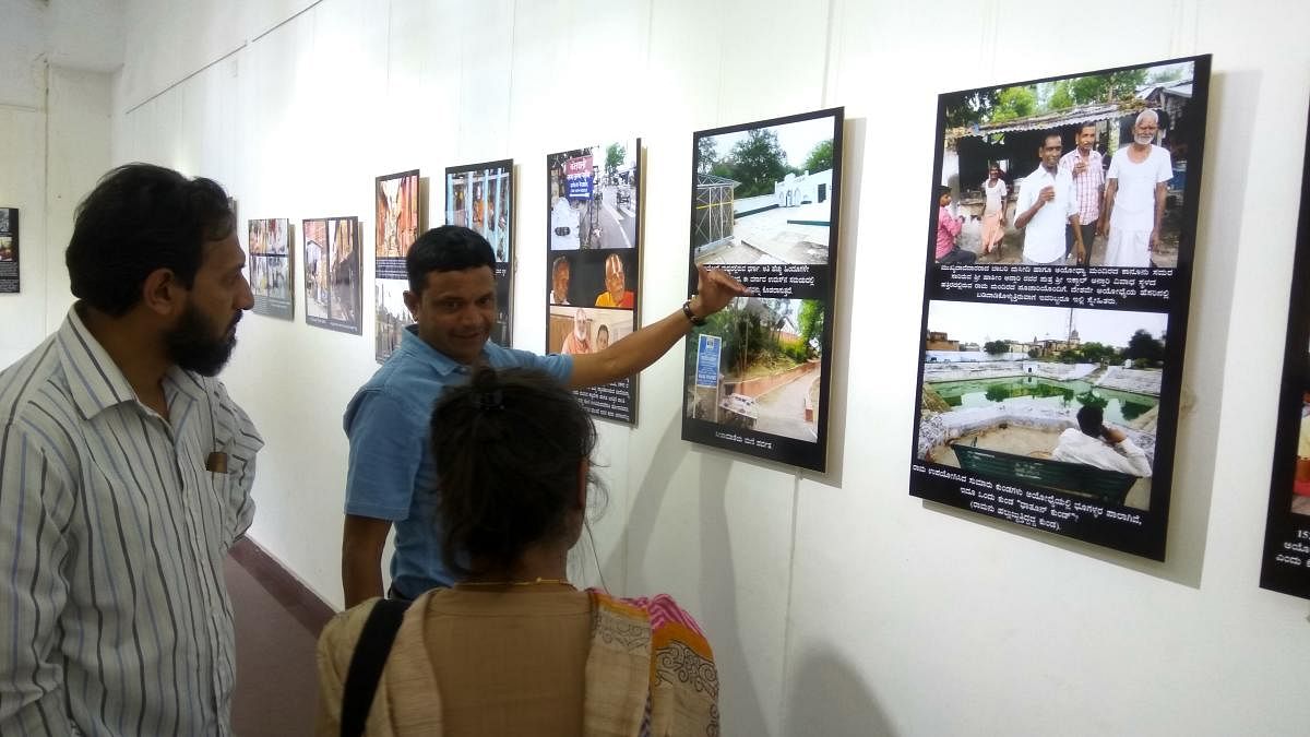 Sudhir Shetty speaks to visitors at the exhibition of his photos titled 'Hey Ayodhya' at Rangoli Art Center on MG Road Boulevard on Tuesday.