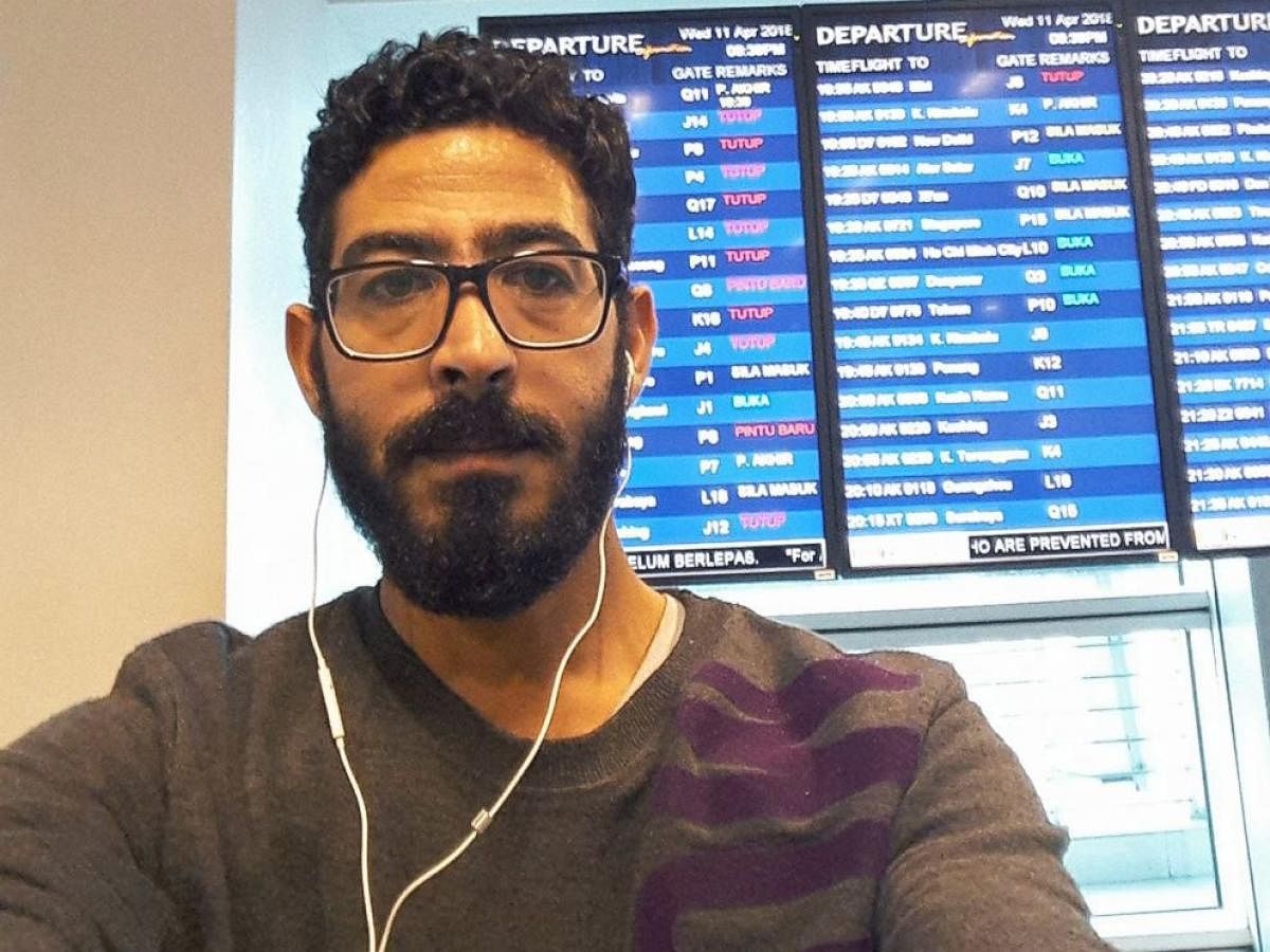 Syrian refugee Hassan al-Kontar inside the Kuala Lumpur airport where he experienced a bizarre saga that drew comparisons with the hit movie "The Terminal". Youtube 