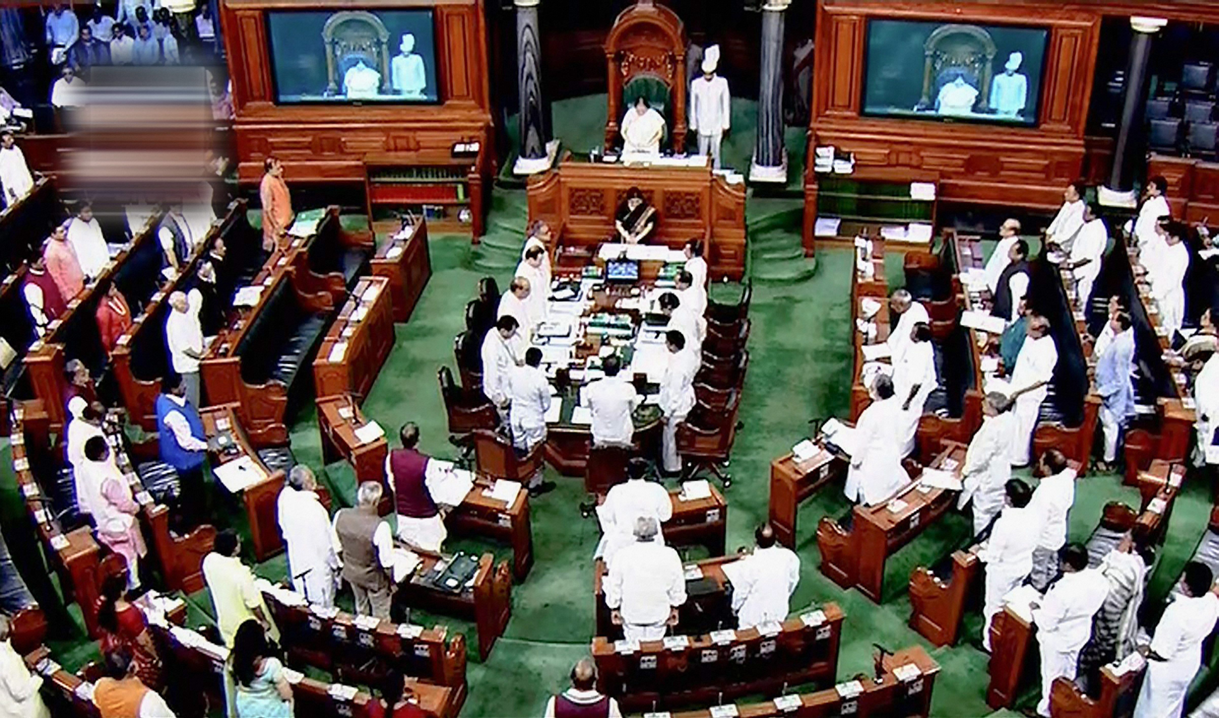 Parliamentarians observe silence during an obituary reference in the Lok Sabha during the Monsoon session of Parliament. Credit: PTI