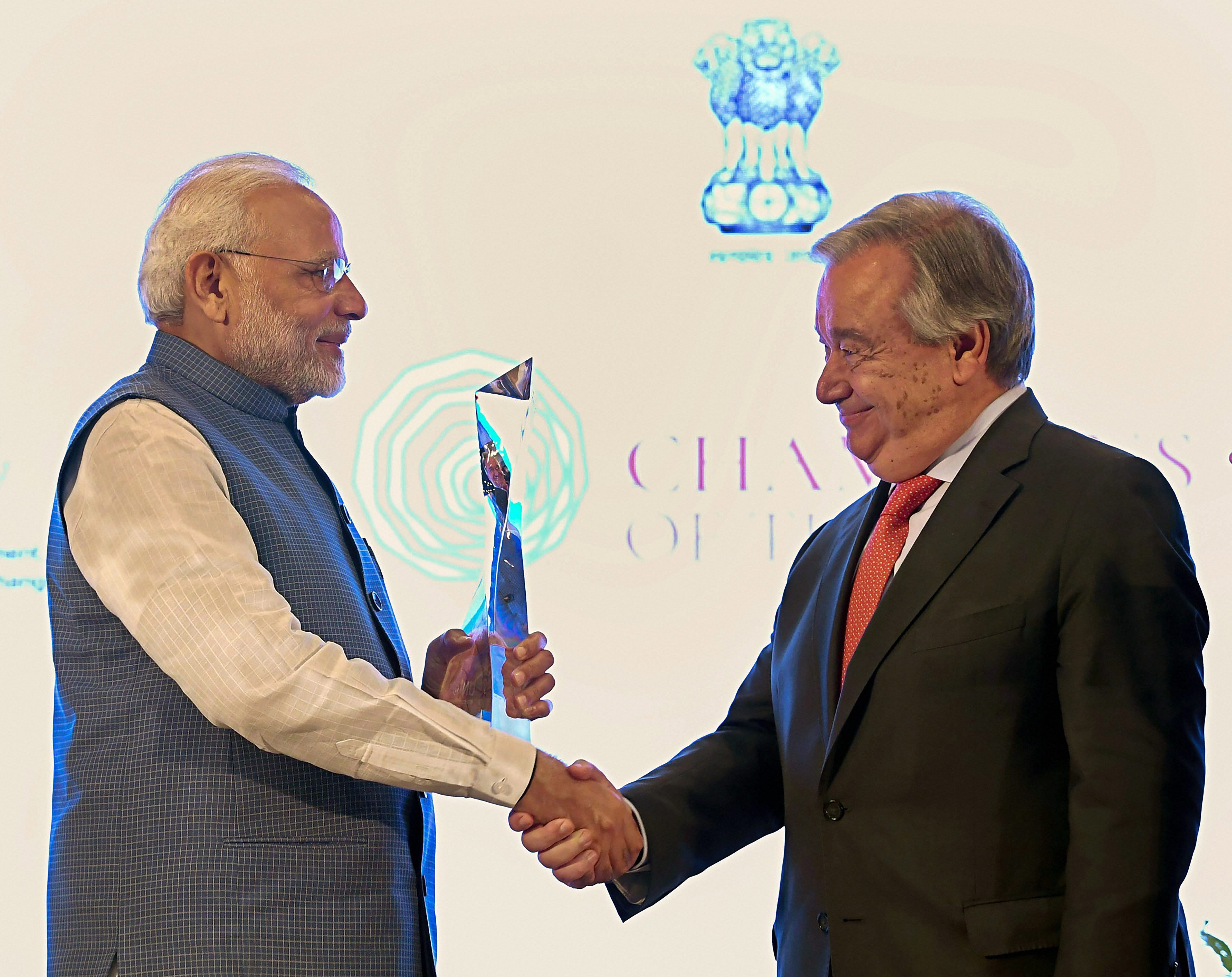 Prime Minister Narendra Modi greets United Nations Secretary General Antonio Guterres after receiving UN's highest environmental honour 'Champions of The Earth Award' at a special ceremony, in New Delhi on Wednesday. (PIB Photo via PTI)