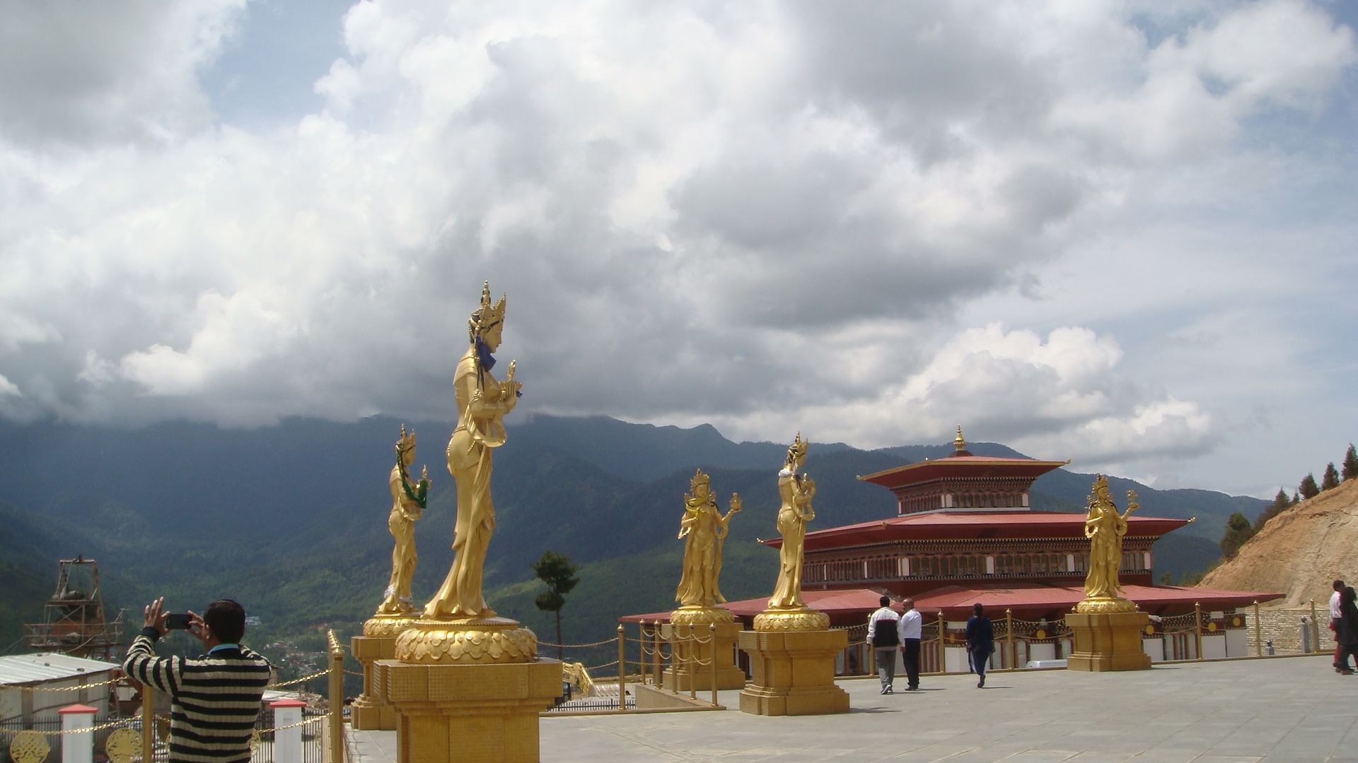 Bhutan is a land-locked country with scenic hills and valleys, Dzongs, stupas and statues of Buddha.