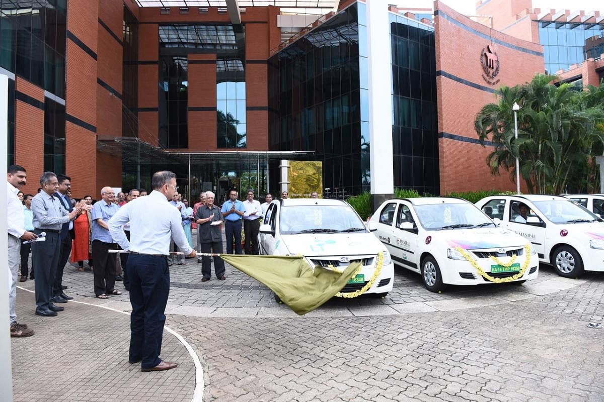 Dr Ranjan Pai, Chairman, Manipal Education and Medical Group, flags off a fleet of electric cars in Manipal.