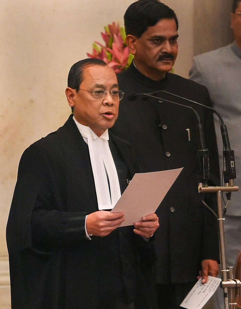 Justice Ranjan Gogoi takes his oath of office after he was appointed as the 46th Chief Justice of India at Rashtrapati Bhawan in New Delhi. PTI