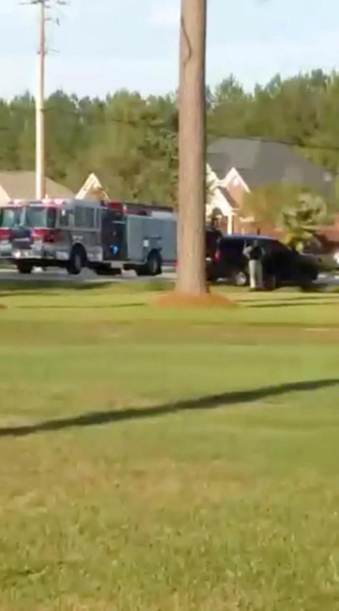 Emergency personnel are seen on site in the aftermath of a shooting in Florence, South Carolina, U.S. October 3, 2018, in this still image obtained from a social media video. (Derek Lowe/via REUTERS)