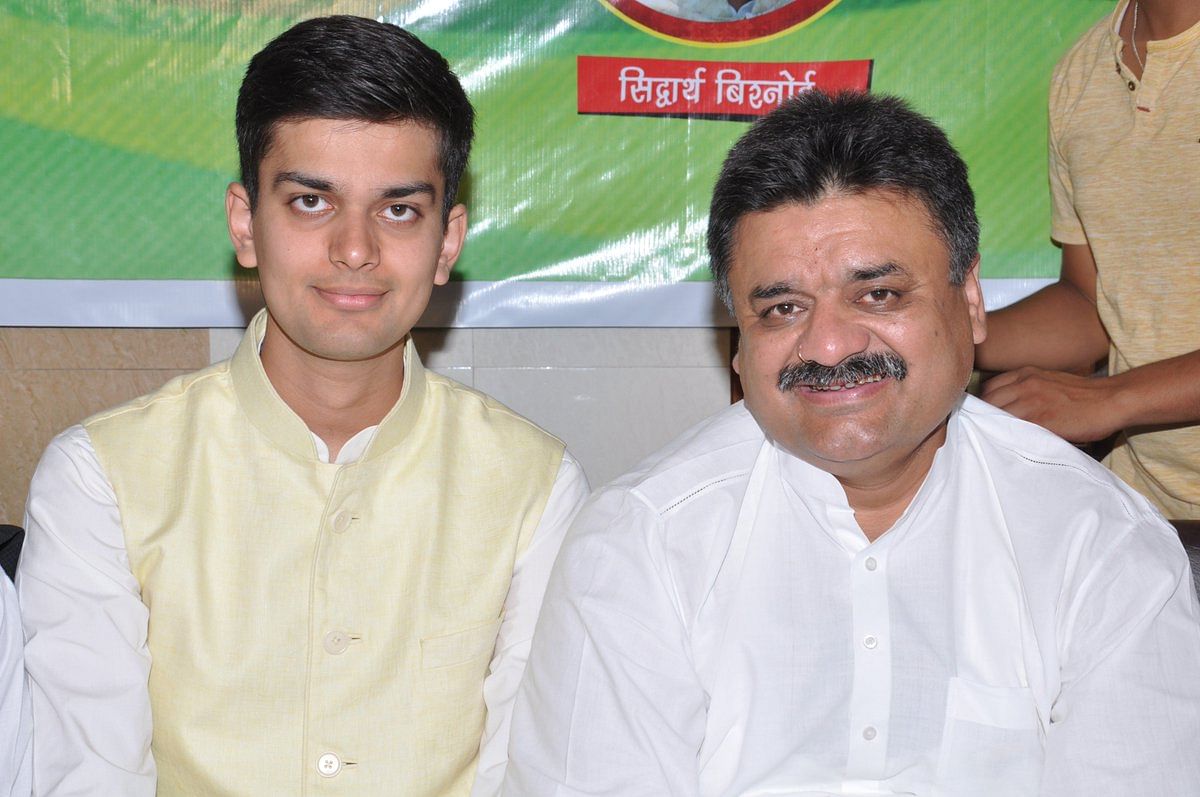Former Haryana deputy chief minister Chander Mohan (R) with son Siddharth Bishnoi. Twitter