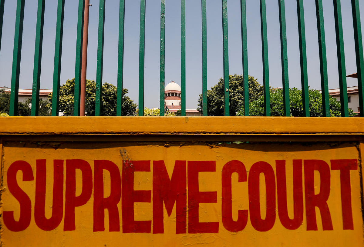 A signboard is seen outside the premises of Supreme Court. REUTERS/FILE