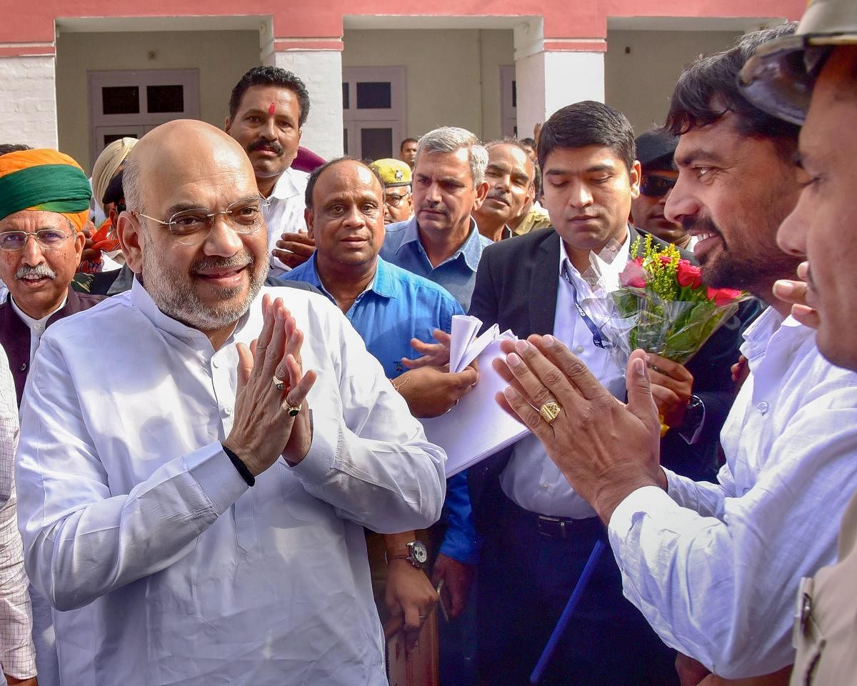 Bharatiya Janata Party (BJP) President Amit Shah meets his party workers at Circuit house, in Bikaner. PTI Photo