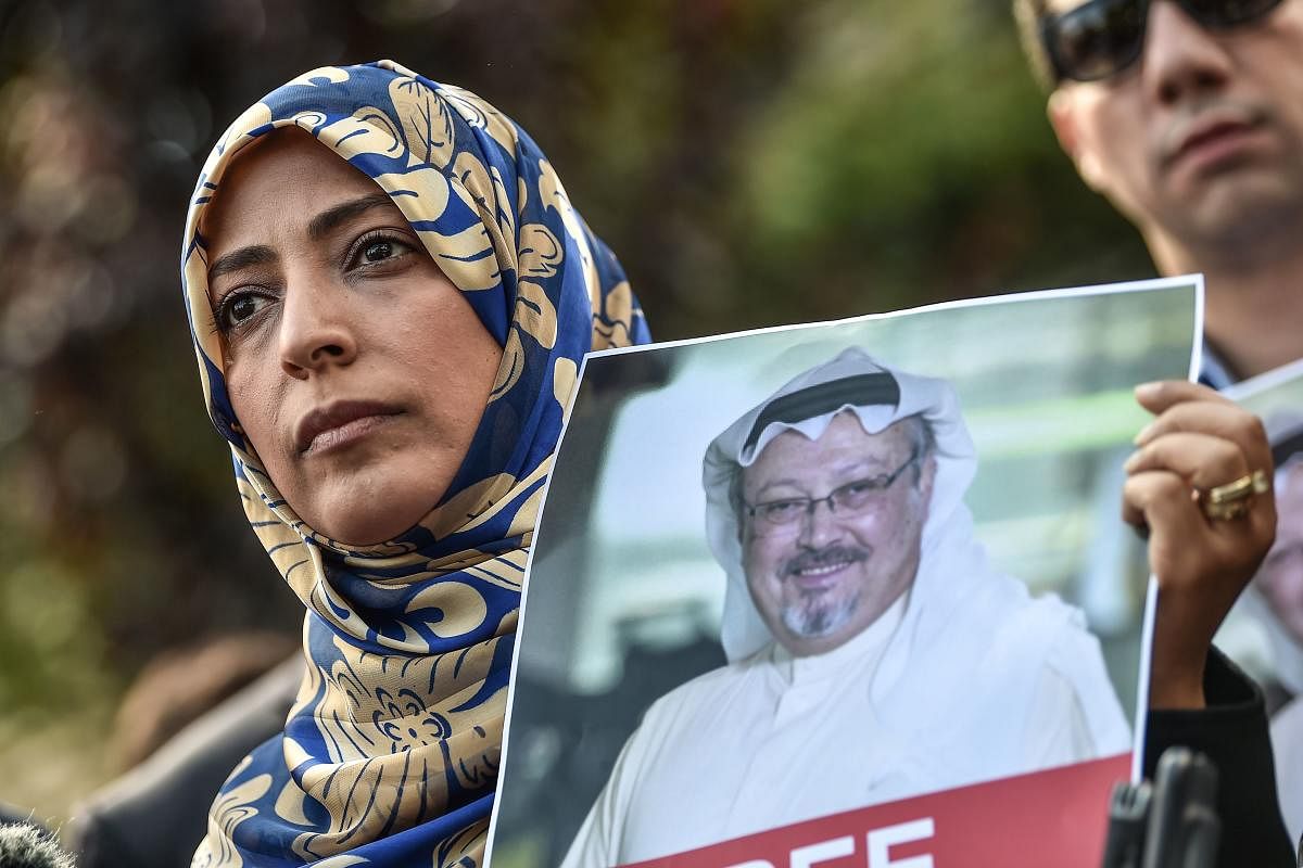 Nobel Peace Prize laureate Yemeni Tawakkol Karman holds a picture of missing journalist Jamal Khashoggi during a demonstration in front of the Saudi Arabian consulate in Istanbul on October 5, 2018. AFP
