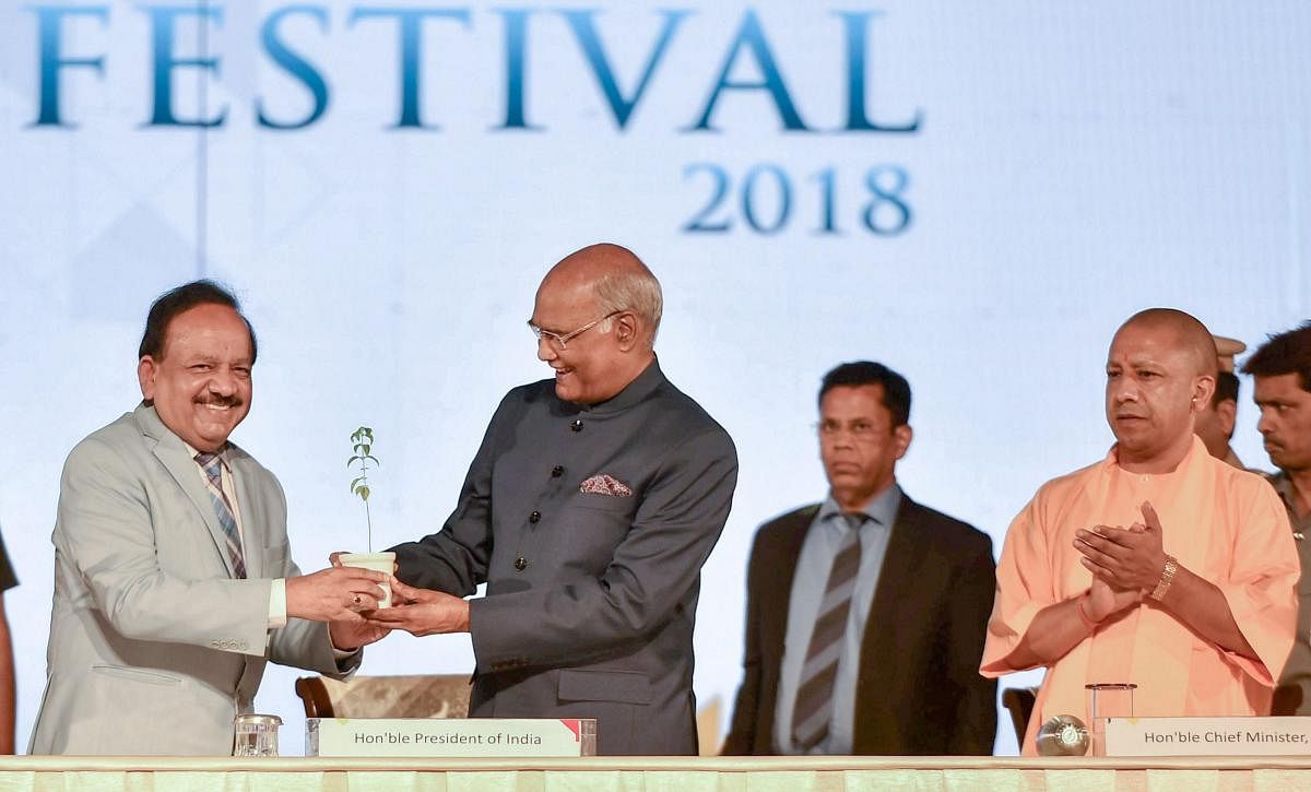 Union Environment Minister Harsh Vardhan felicitates President Ram Nath Kovind as Uttar Pradesh Chief Minister Yogi Adityanath looks on, at the India International Science Festival (IISF), in Lucknow on Saturday. PTI