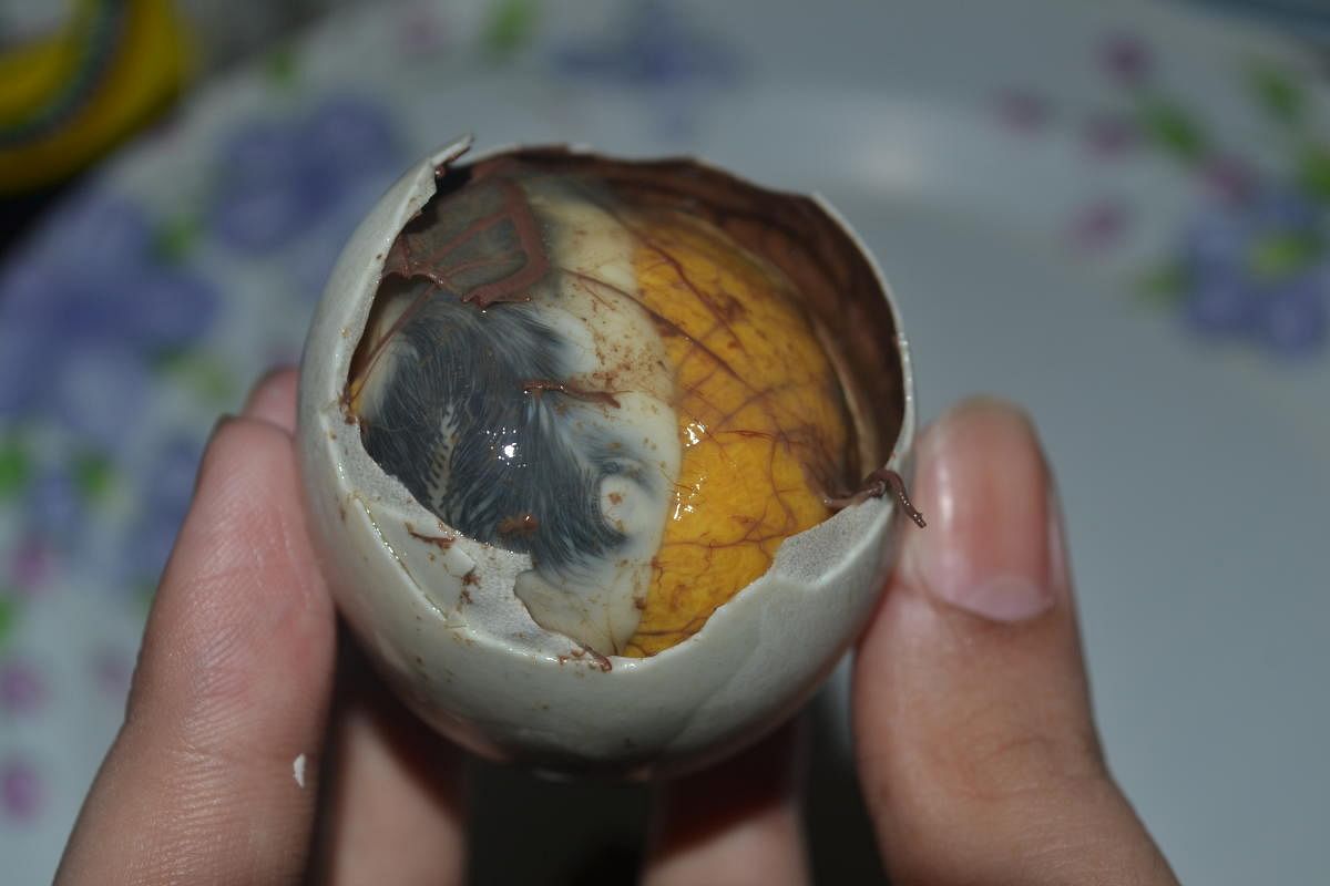 Balut, the 17-day boiled embryo. 
