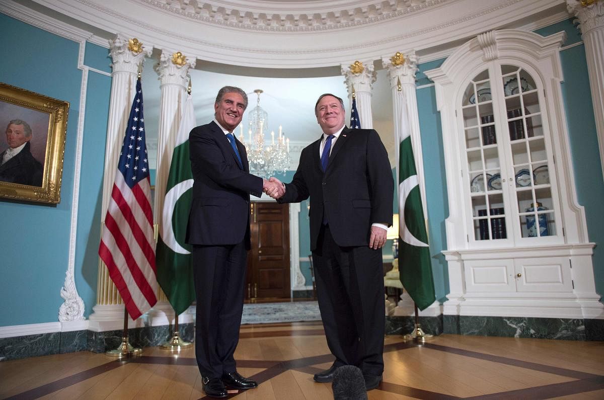 US Secretary of State Mike Pompeo (R) meets with Pakistani Foreign Minister Shah Mehmood Qureshi at the US State Department in Washington. (AFP File Photo/ANDREW CABALLERO-REYNOLDS)