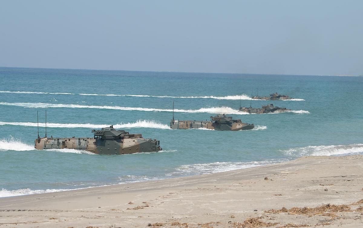 Japanese Ground Home Defence Forces Amphibious Assault Vehicles hit the beach of the Philippine navy training centre facing the South China Sea in San Antonio town, Zambales province, north of Manila on October 6, 2018. AFP