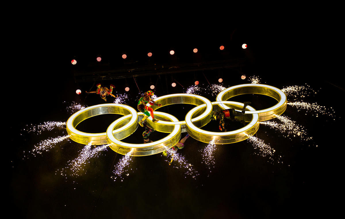 The Olympic Rings appear in the air as actors perform around them during the opening ceremony of the Youth Olympic Games in Buenos Aires on Sunday. Reuters