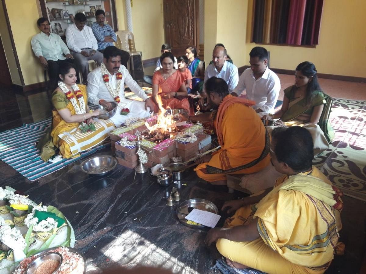 B Y Vijayendra and his family members take part in the house-warming ceremony at Varuna village, in Mysuru taluk, on Friday