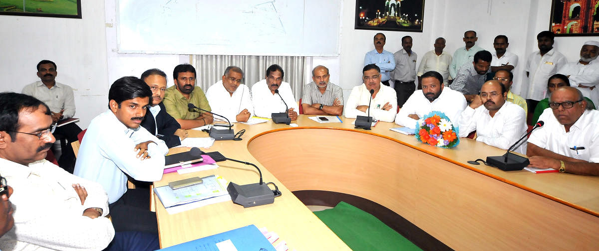 IT/BT and Largescale Industries Minister K J George addresses a meeting of representatives of industries and government officials in Mysuru on Tuesday.