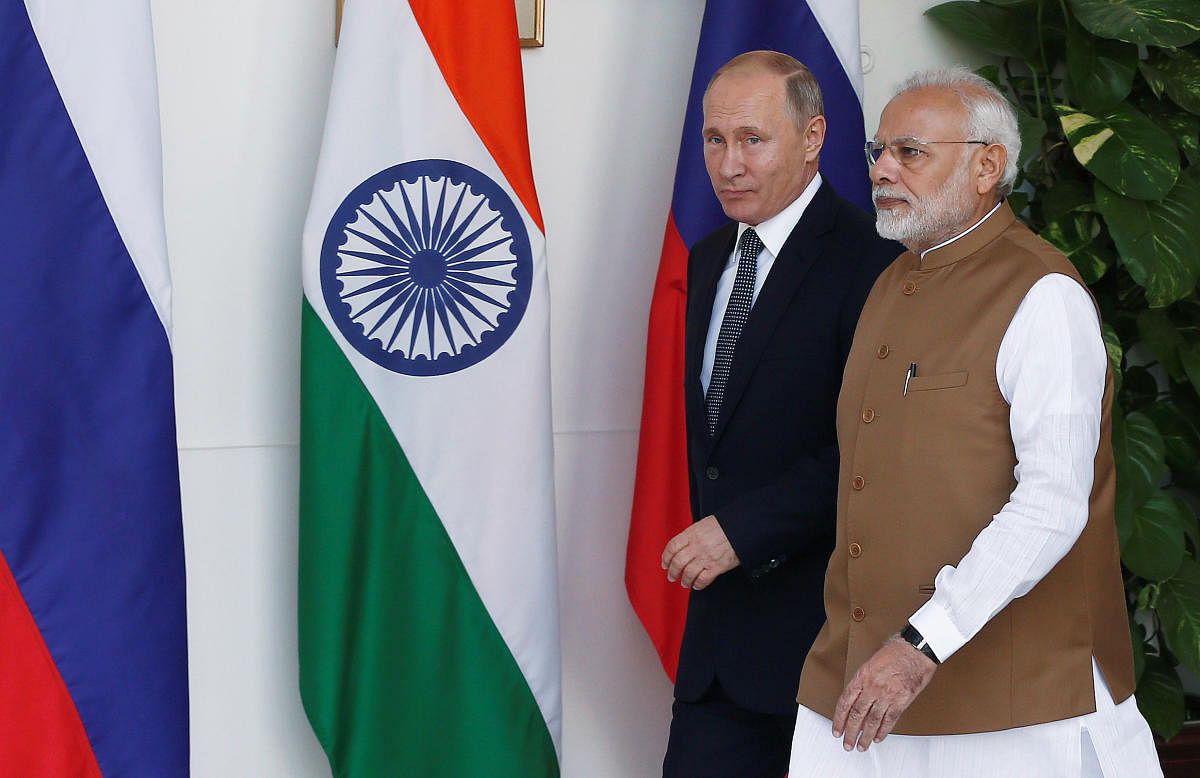 Russian President Vladimir Putin and India's Prime Minister Narendra Modi arrive ahead of their meeting at Hyderabad House in New Delhi, India on October 5, 2018. REUTERS