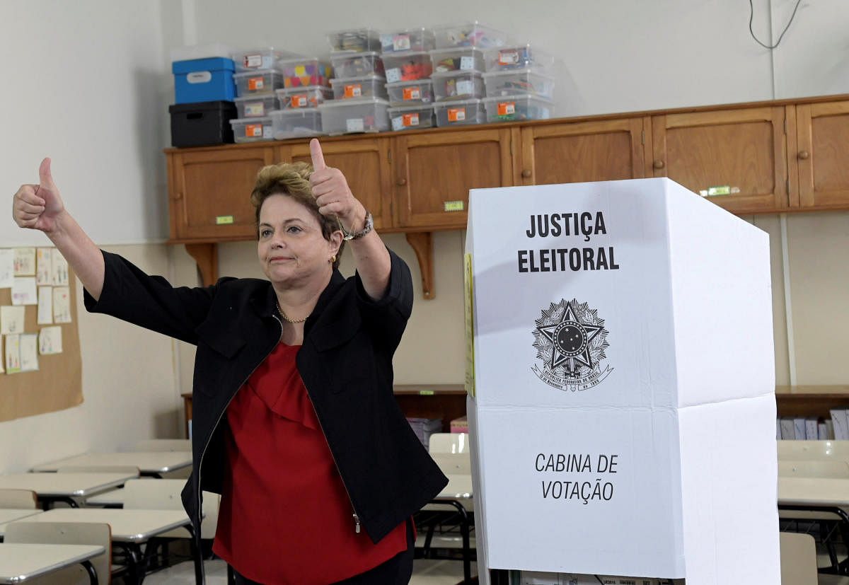 Brazil's former president and senate candidate Dilma Rousseff of the leftist Workers Party (PT) gestures after casting her vote, in Belo Horizonte, Brazil October 7, 2018. REUTERS