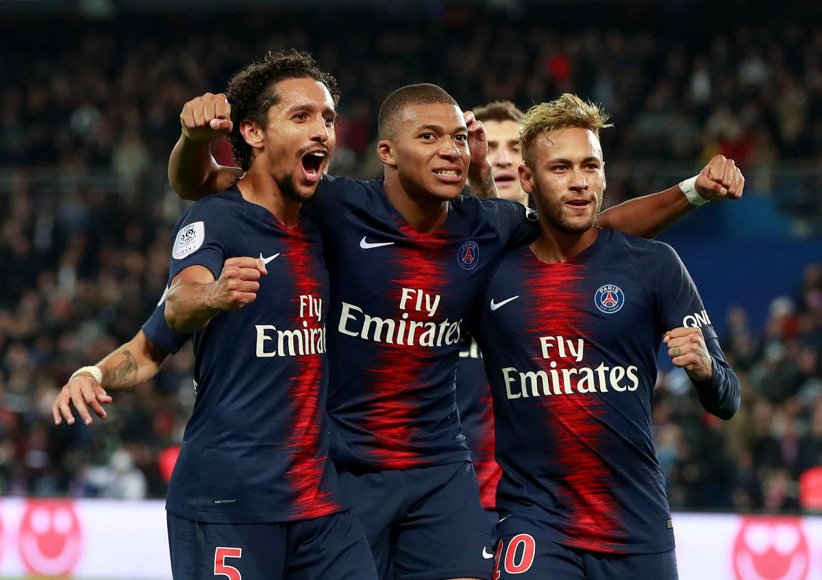 Paris St Germain's Kylian Mbappe celebrates scoring their fifth goal with teammates. (REUTERS)