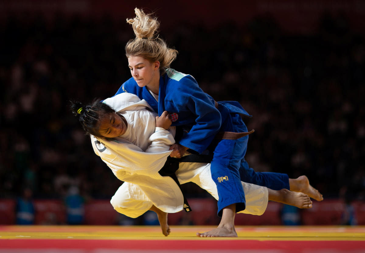 India's Thangjam Tababi Devi (white) is taken down by Ana Viktorija Puljiz of Croatia in the judo women's 44kg final at Buenos Aires on Sunday. REUTERS