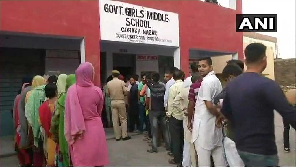 People queue up to vote in ULB polls in Gorakh Nagar, Jammu. (ANI photo)