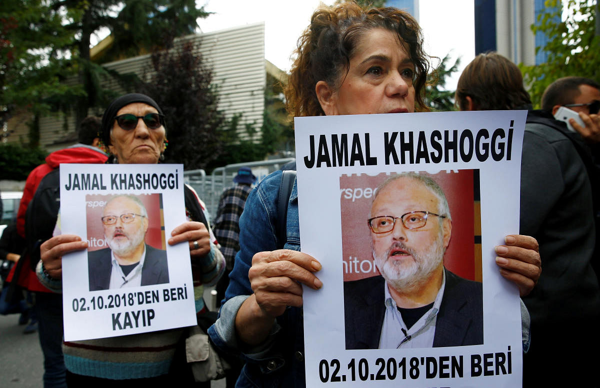 Human rights activists hold pictures of Saudi journalist Jamal Khashoggi during a protest outside the Saudi Consulate in Istanbul, Turkey October 9, 2018. (REUTERS)