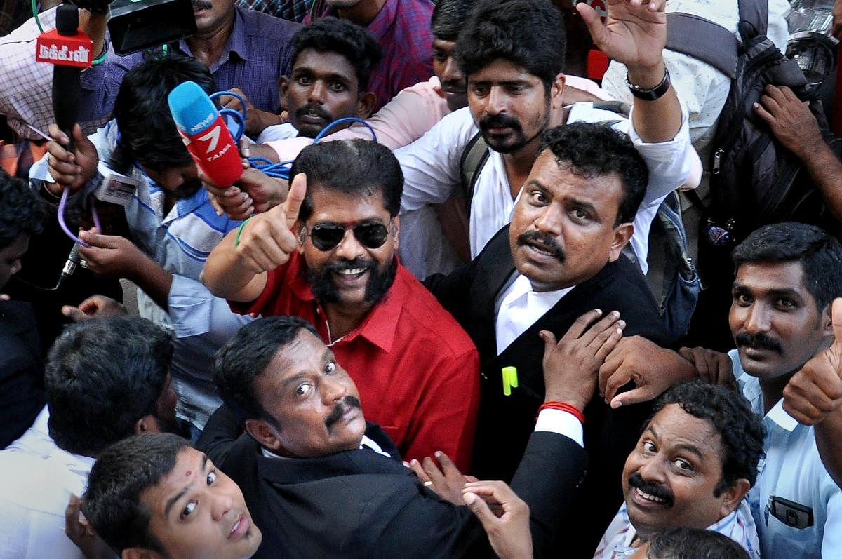 Senior journalist R Gopal, editor of Tamil magazine 'Nakkheeran', addresses the media as he is being taken to court, in Chennai, on Tuesday. The weekly's website claimed Gopal was arrested based on a complaint from the Raj Bhavan over a write-up on Nirmala Devi, an assistant professor of a private college in Virudhunagar who had been arrested for allegedly prodding girl students to extend sexual favours to officials. PTI
