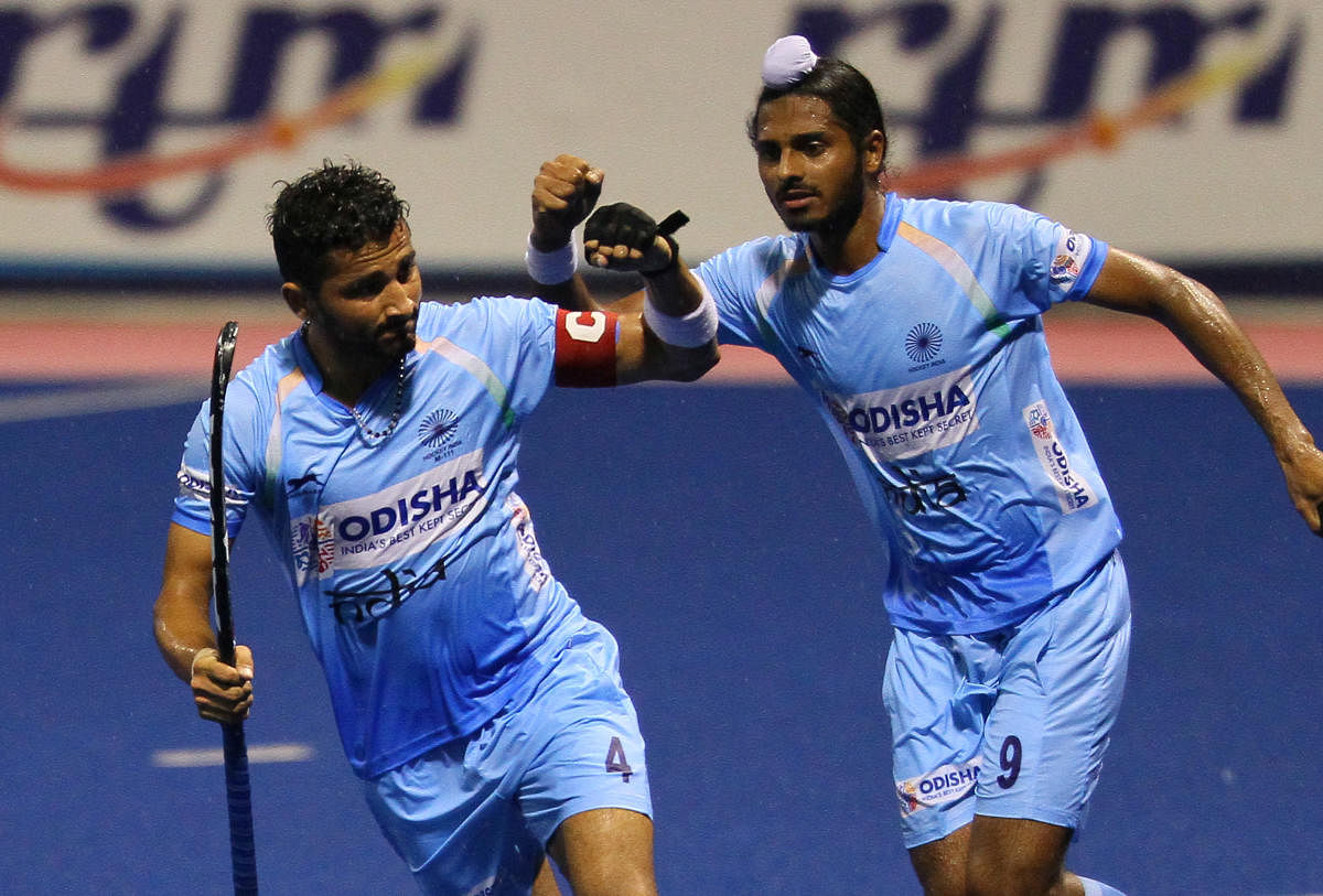 India's Mandeep Mor (left) celebrates after scoring against Australia during their Sultan of Johor Cup match on Wednesday. 