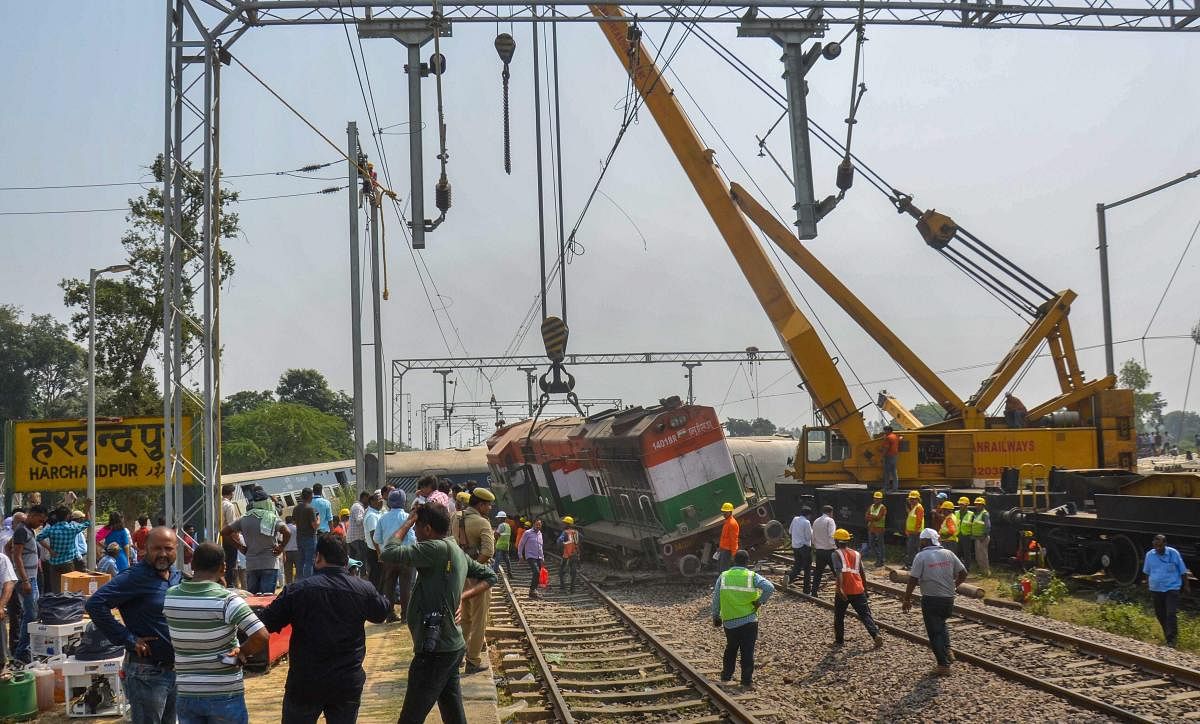 Cranes remove the train from the site of the accident where eight coaches and engine of the New Farakka Express train derailed near Raebareli, Wednesday, Oct 10, 2018. At least six people were killed in the accident. (PTI Photo)