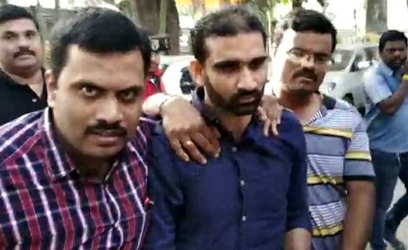 Saleem (centre) being picked up by the CCB. Screengrab.