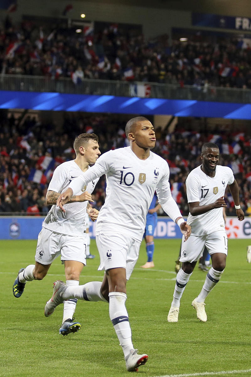 SUPER SUB: France's Kylian Mbappe (centre) celebrates after scoring against Iceland in a friendly on Thursday. AP/PTI