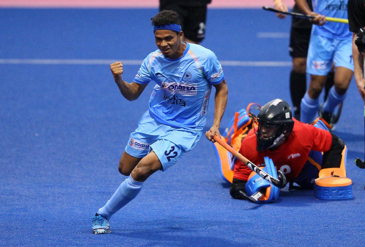  India's Shilanand Lakra celebrates after scoring against Great Britain during their round-robin clash on Friday. 