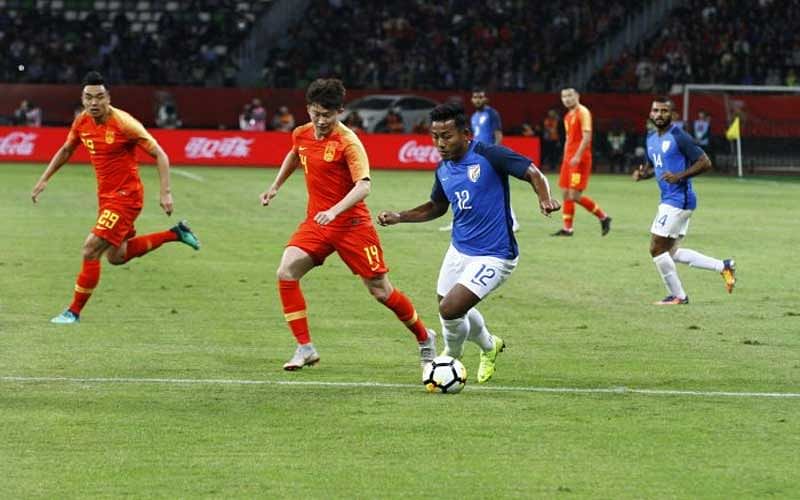 India's Jeje Lalpekhlua (right) attempts to get past China's Wang Tong during their friendly in Suzhou on Saturday.