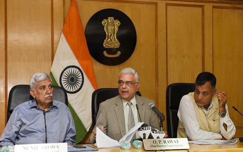 Chief Election Commissioner O P Rawat formally handed over the EPICs in braille to two visually challenged electors at the end of the conference, which the EC held in New Delhi for discussion on ways to make elections accessible for the people with disabilities. (PTI Photo)